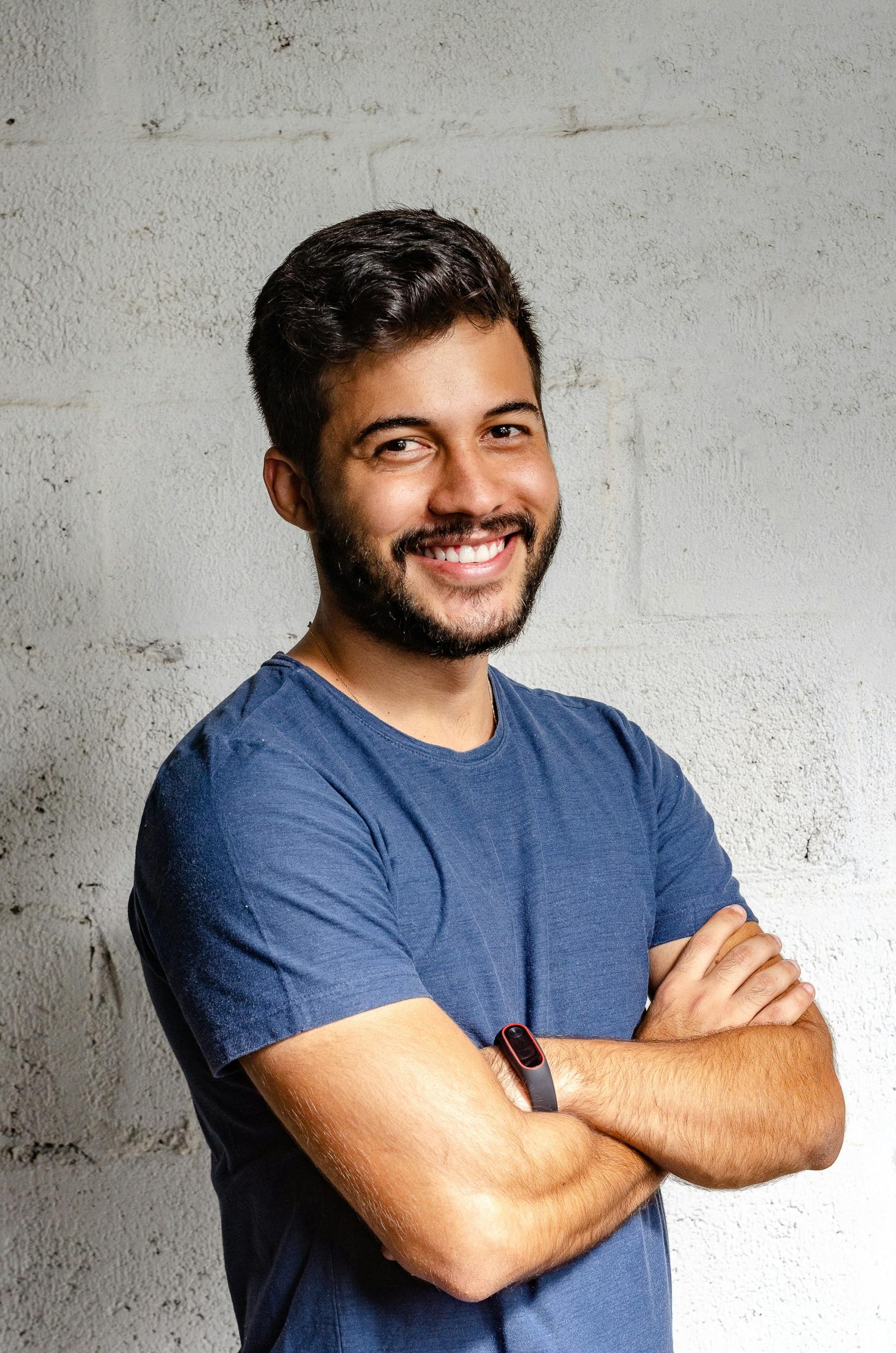 Adult man in blue shirt smiling